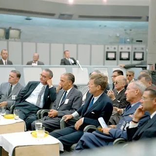 People gathered in a formal conference