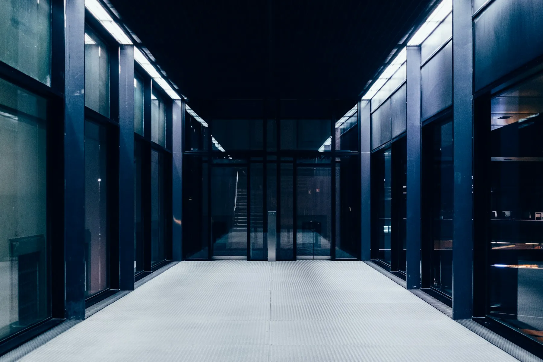 A long secured hallway in a technology facility