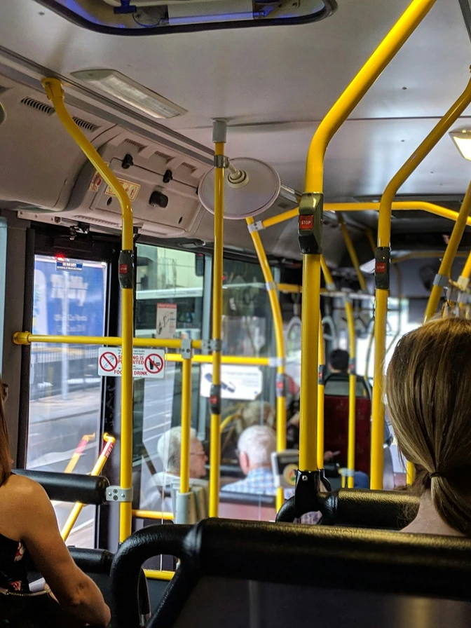 Passengers seated inside a city bus